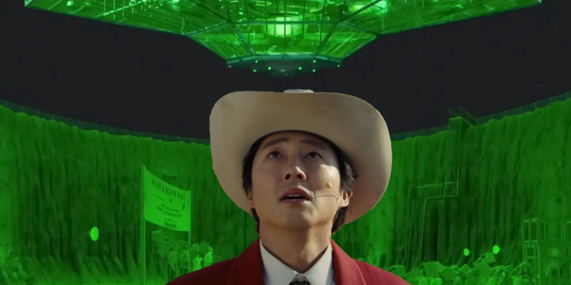 Steven Yeun in Nope with the spaceship from Asteroid City