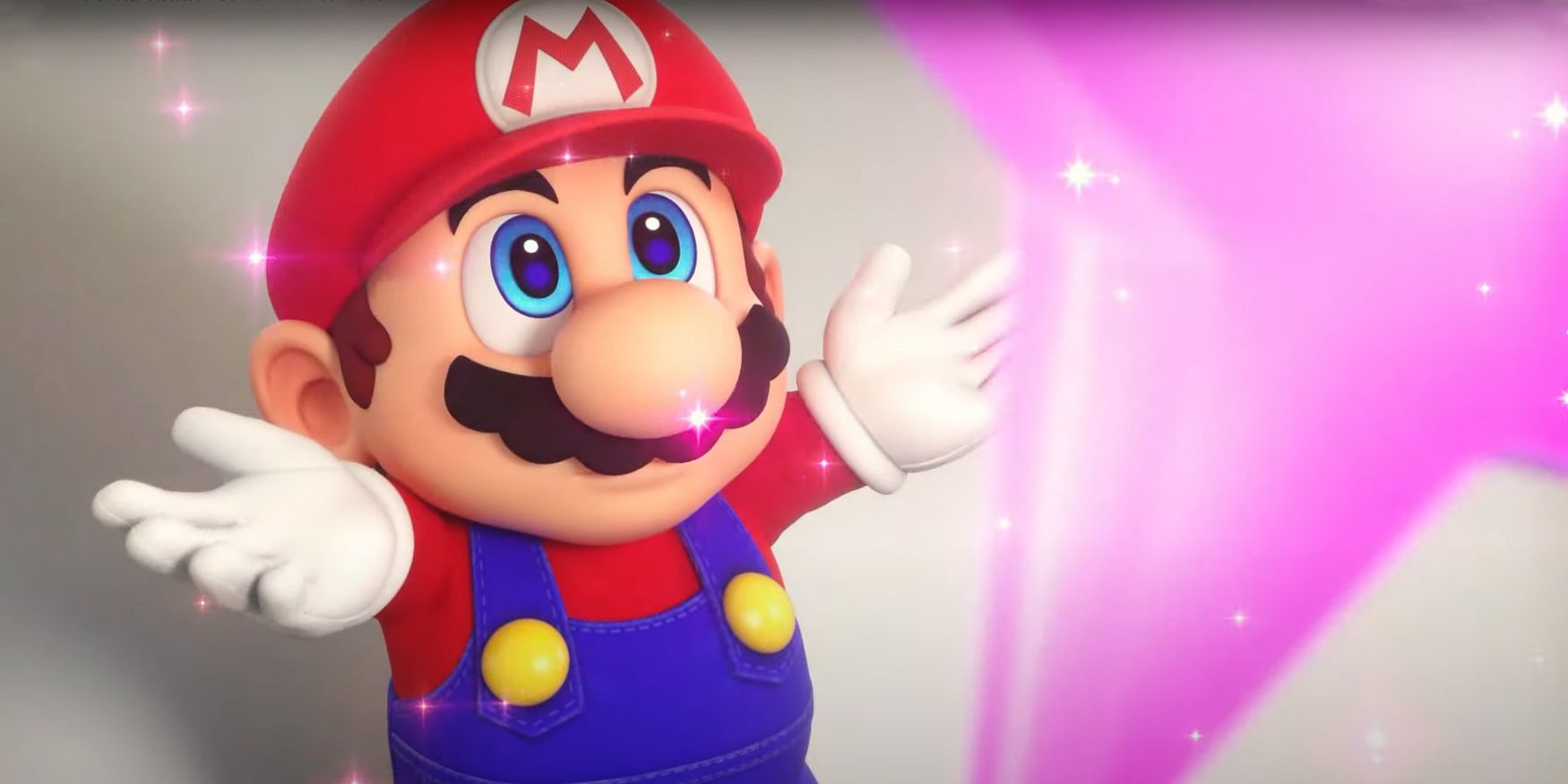 Mario looking up at a pink Super Star with his arms outstretched in the Super Mario RPG remake.