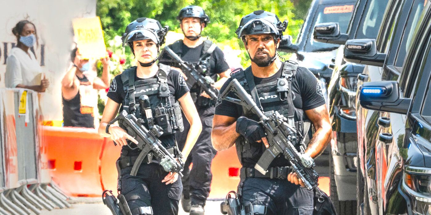 Three heavily armed SWAT team members striding up the street flanked by shiny black vehicles