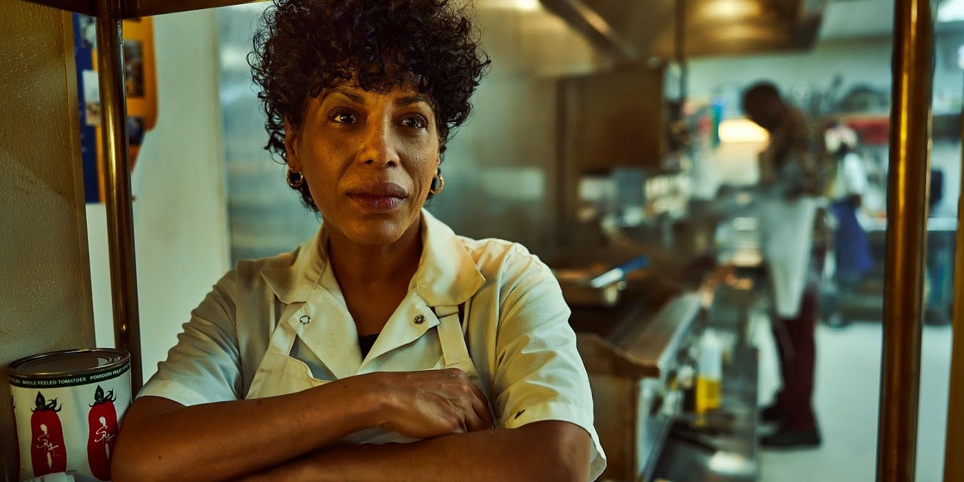Liza Colón-Zayas in the kitchen with her arms crossed in The Bear Season Two