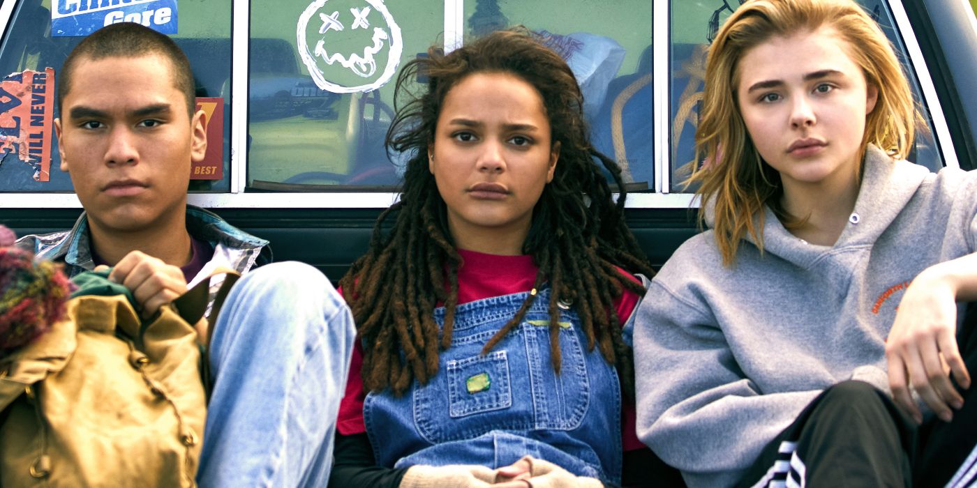 Adam, Jane, and Cameron sit on the back of a pickup truck with the Nirvana symbol on it in The Miseducation of Cameron Post.