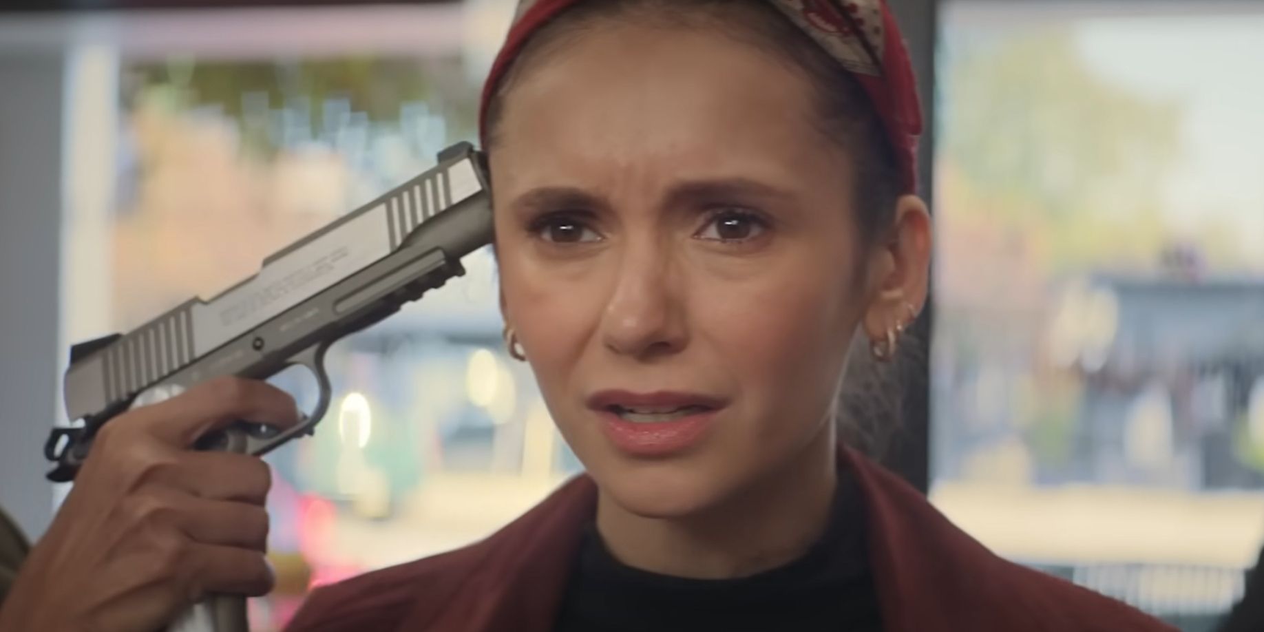 The Out-Laws Nina Dobrev as Parker McDermott with a gun to her head