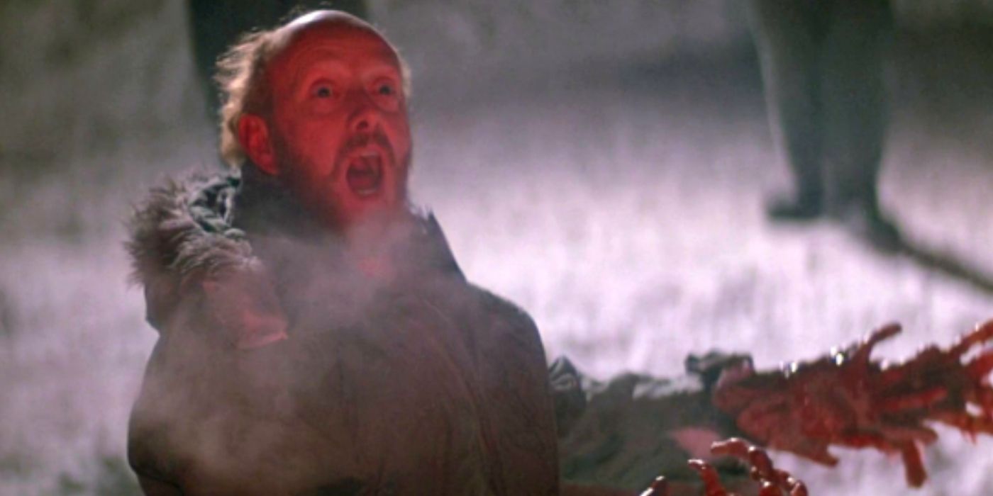 A screaming man with alien hands in The Thing.
