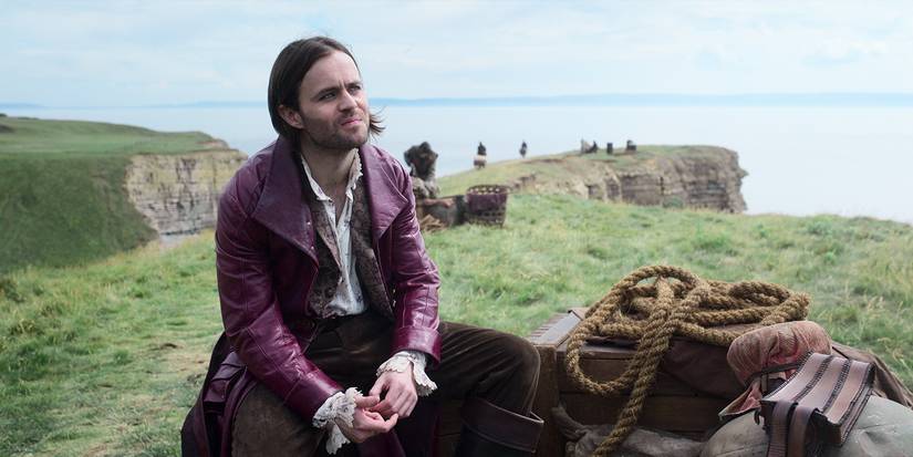 Jaskier sat on a hill next to some rope in The Witcher season 3 part 1.