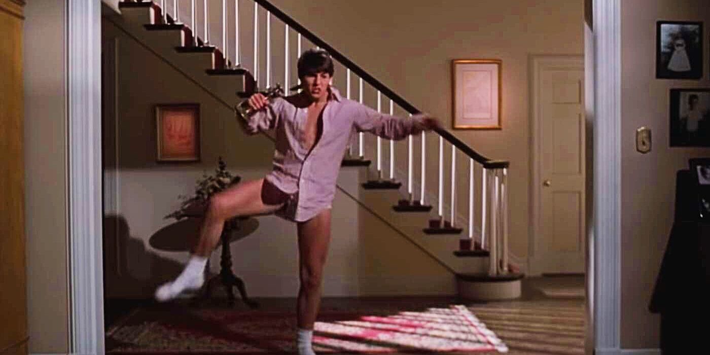 Tom Cruise como Joel bailando con camisa abotonada y ropa interior en Risky Business