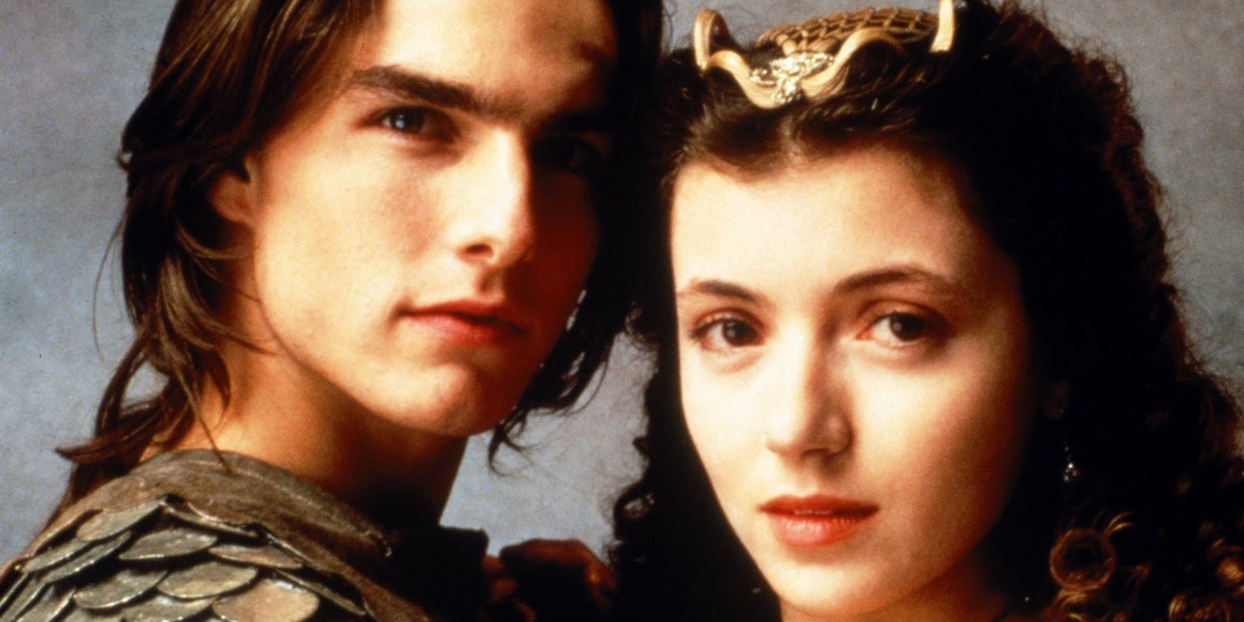 Tom Cruise and Mia Sara looking at the camera in a promo for Legend
