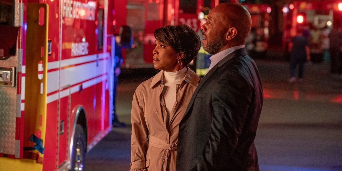 two characters looking at a fire truck in 9-1-1 episode Defend in Place