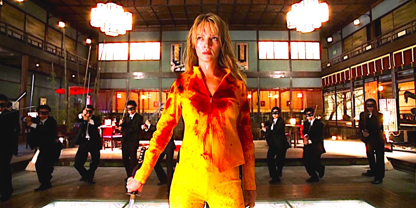 Uma Thurman as the Bride in Kill Bill wearing a blood-soaked yellow costume, posing with a sword in front of several masked men in black suits, also brandishing swords