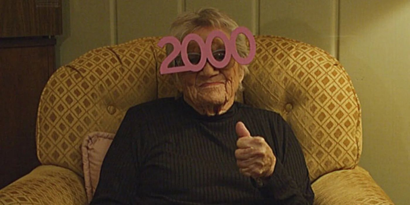 A woman gives a thumbs up while wearing New Years Eve glasses in VHS 99