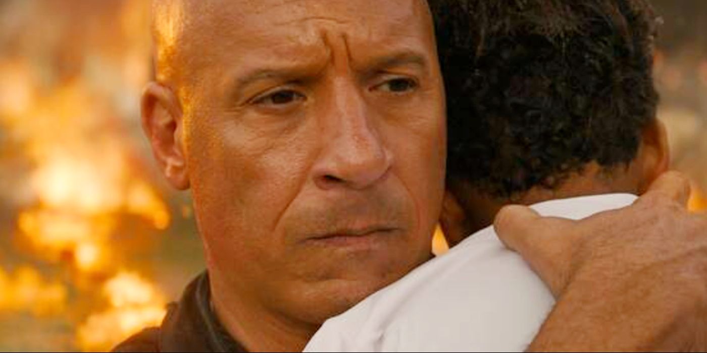 Vin Diesel looking concerned and hugging his son in Fast X. 