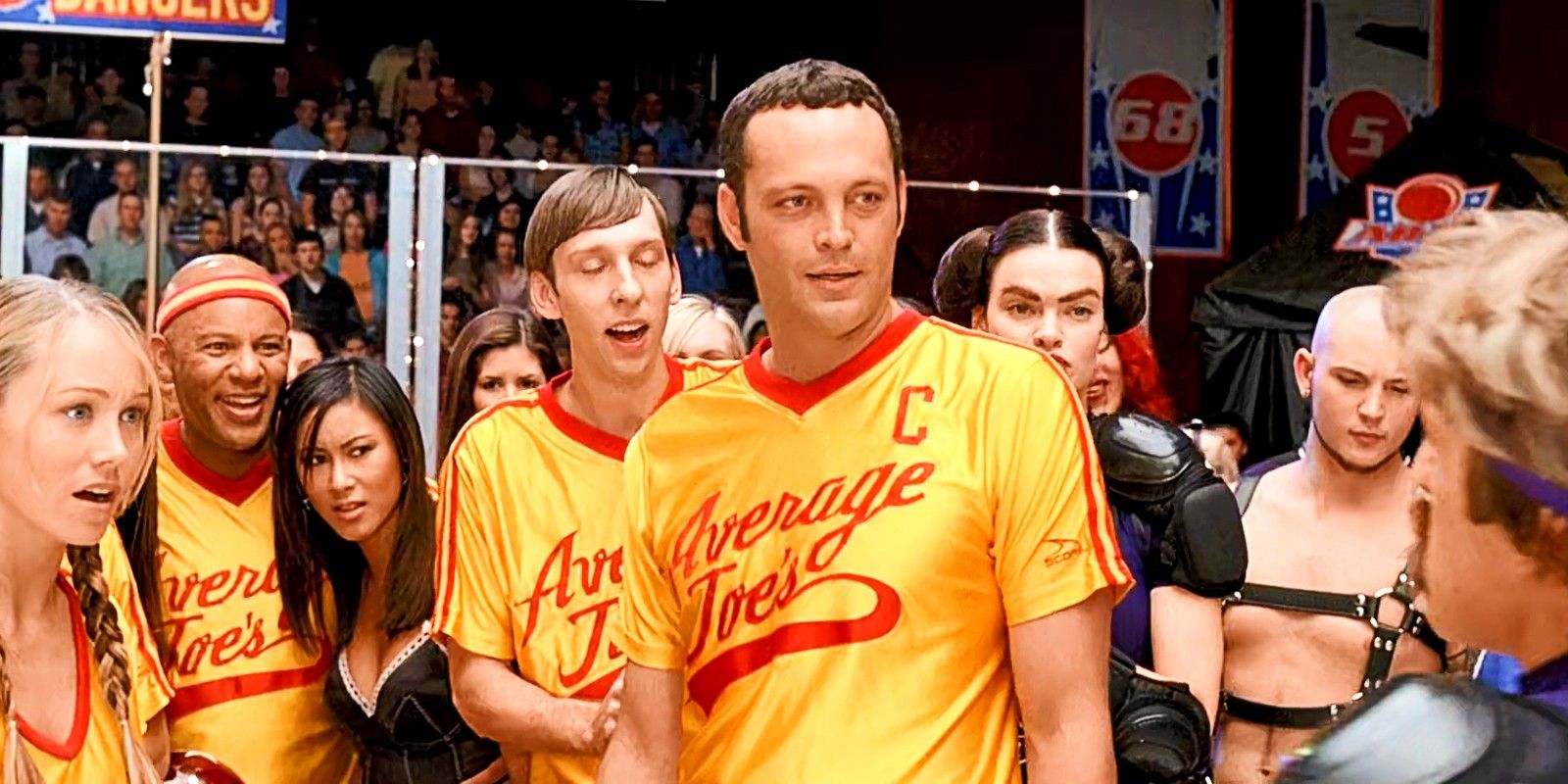 Vince Vaughn in Dodgeball surrounded by Average Joes team looking at Ben Stiller