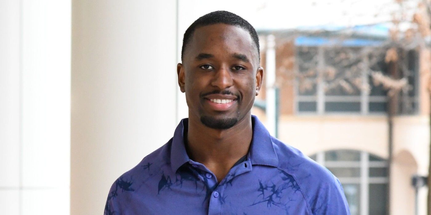 Xavier Bonner The Bachelorette wearing blue shirt smiling indoors