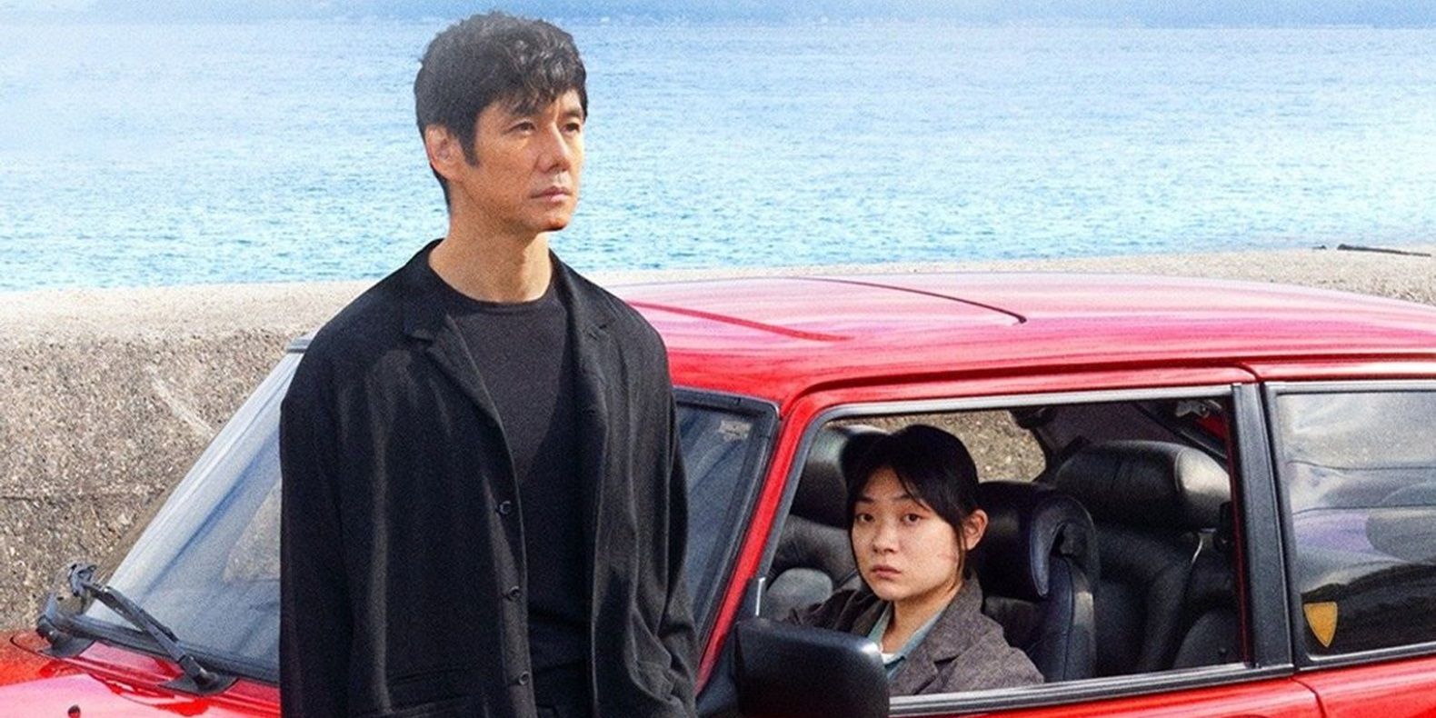 Hidetoshi Nishijima as Yūsuke Kafuku standing by the car with Tōko Miura as Misaki Watariin Drive My Car