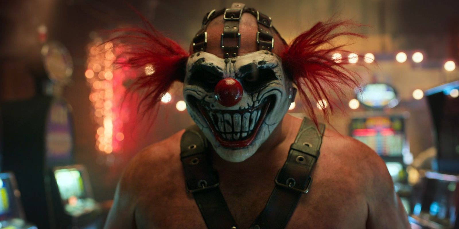 Sweet Tooth looks directly at the camera while wearing his clown mask.