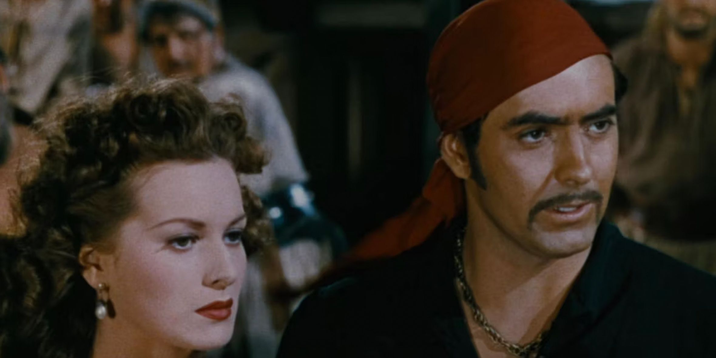 A young woman next to a pirate in The Black Swan in 1942