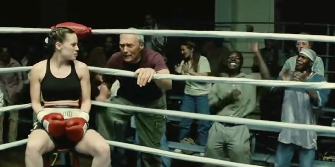 Frank talking to Maggie in the ring while a crowd watches in Million Dollar Baby