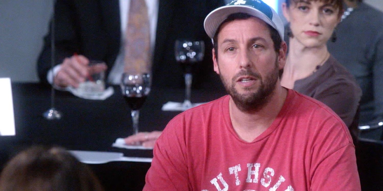 An image of Adam Sandler sitting at a table in Brooklyn Nine-Nine