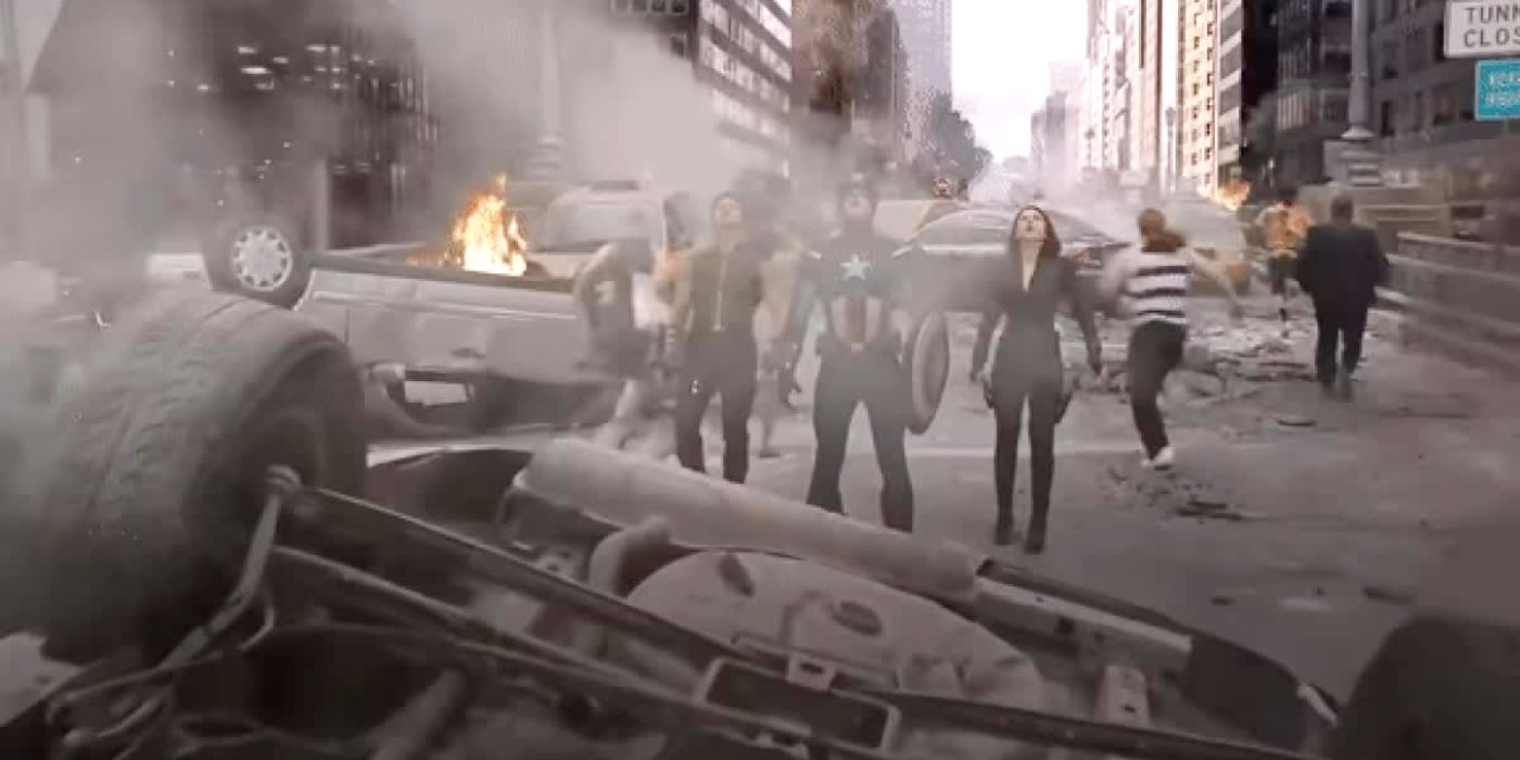 An image of Clint, Steve and Natasha staring at the sky while civilians sprint down the road in The Avengers