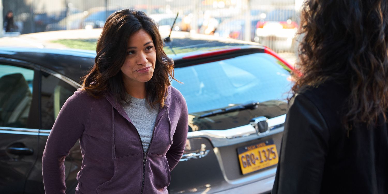 An image of Gina Rodriguez smiling at Stephanie Beatriz in Brooklyn Nine-Nine