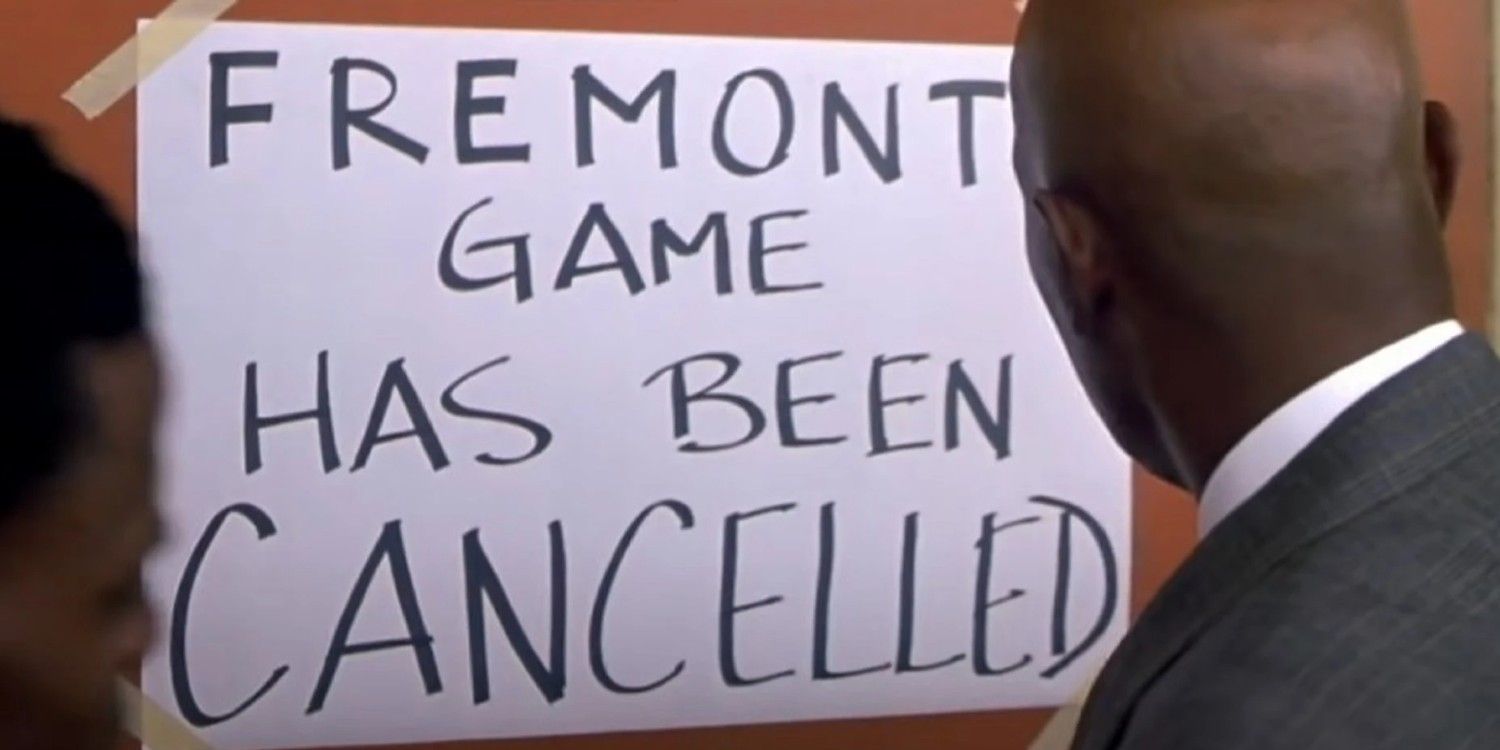 An image of the coach putting up a poster canceling the game in Coach Carter