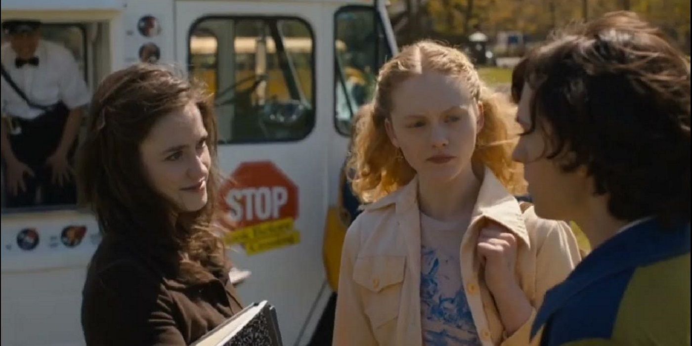 Danny and annabelle talking near the school bus
