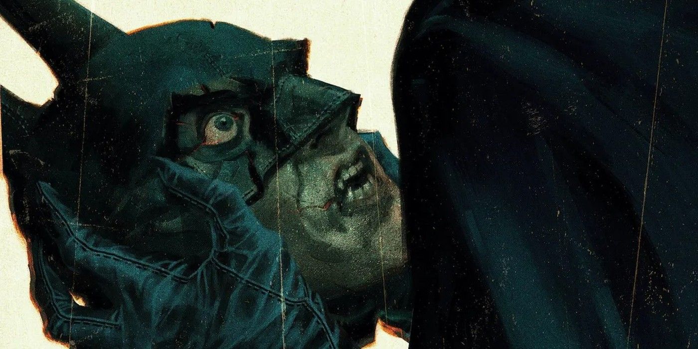 Batman&rsquo;s head in the hands of Bruce Wayne