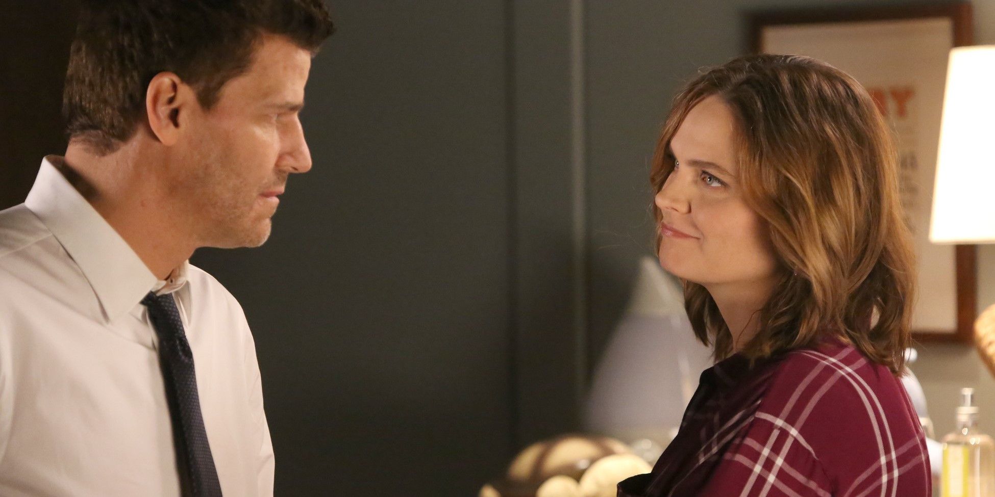 Booth and Brennan staring at one another in Bones