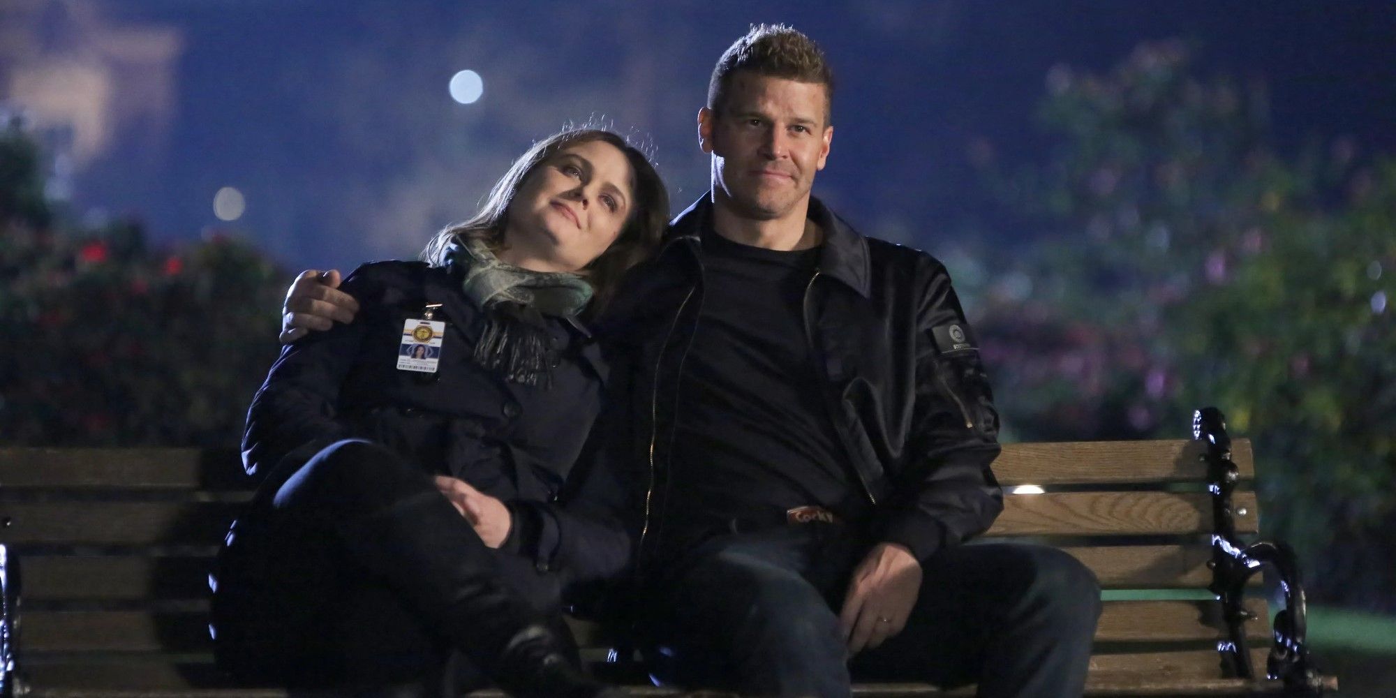 Brennan and Booth sitting on a bench in Bones Season 12