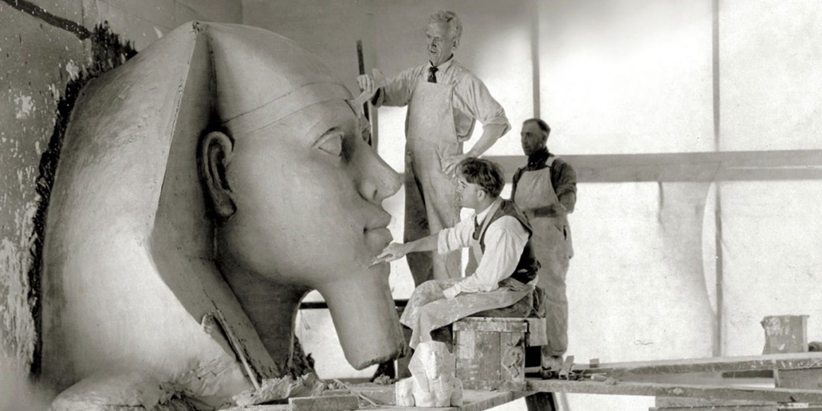 Builders working on a sphinx head for The Ten Commandments