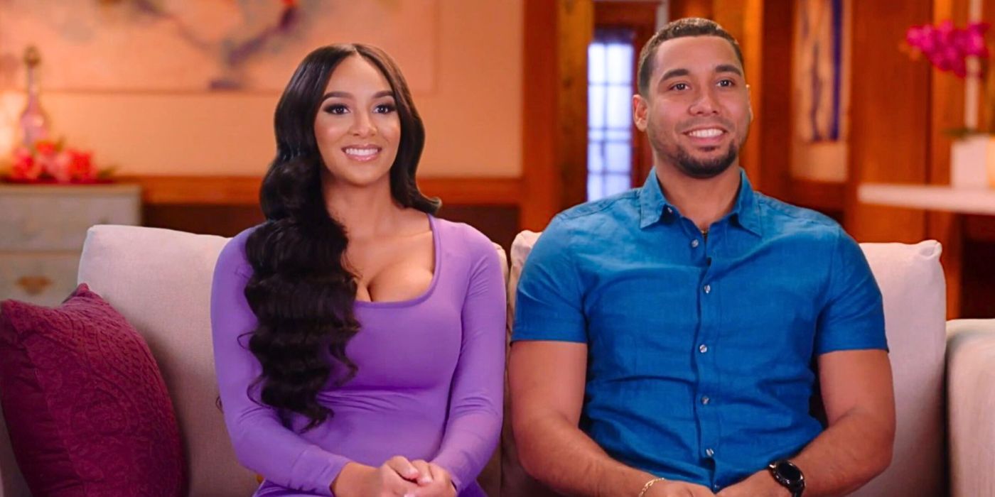 Chantel Everett and Pedro Jimeno smiling together sitting on couch and smiling