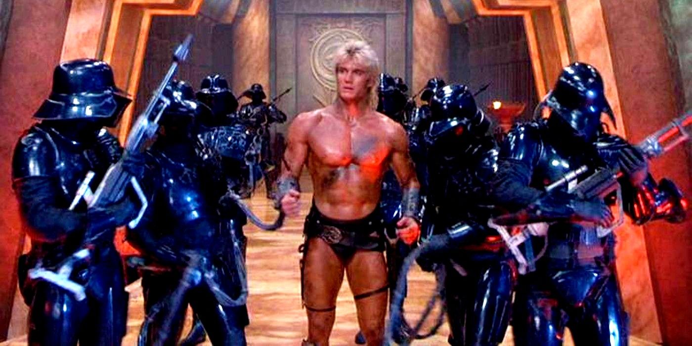 Dolph Lundgren as He-Man chained and surrounded by guards