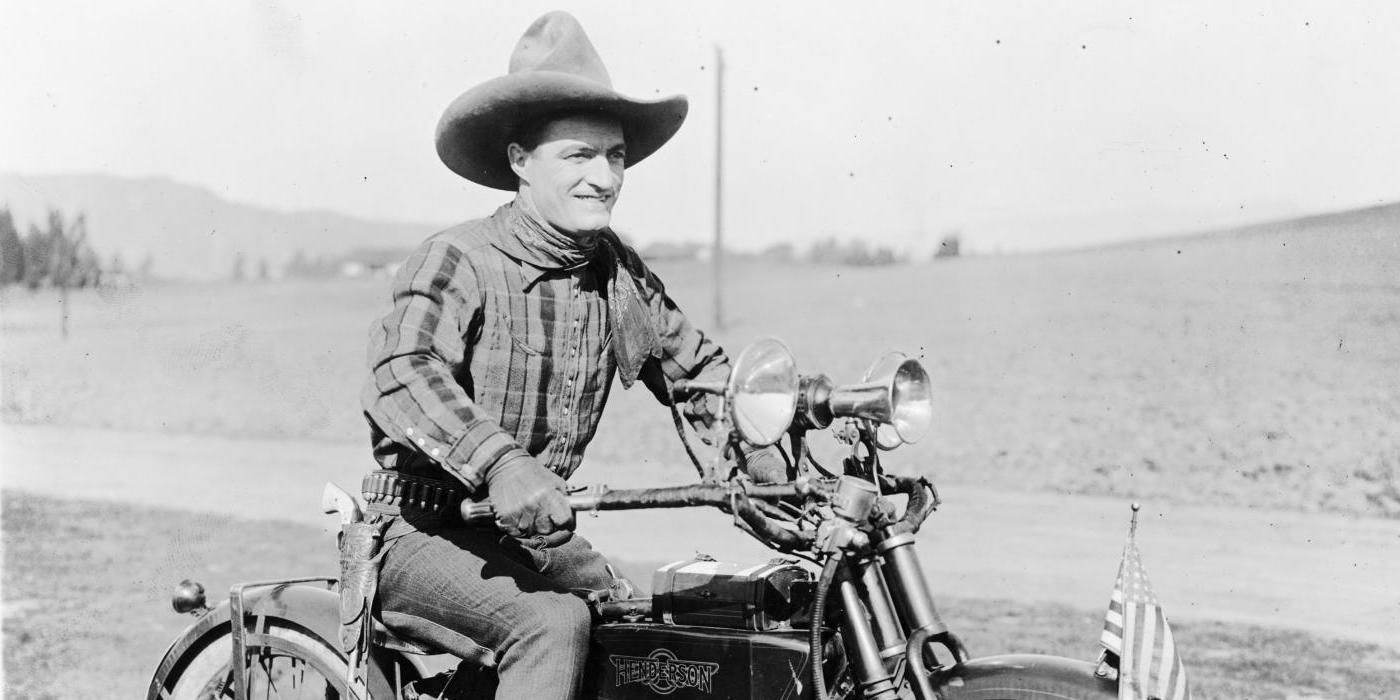 Tom Mix on a motorcycle.