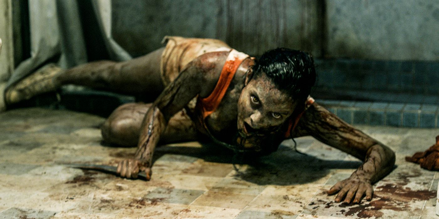 Deadite Olivia crawling on the floor in Evil Dead 2013