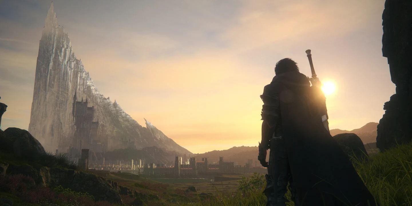 Clive berdiri di dataran berumput dekat matahari terbit dalam screenshot dari Final Fantasy 16. Di kejauhan, Mothercrystal Drake's Head berjenjang menjulang di atas kastil Oriflamme yang menjulang tinggi.