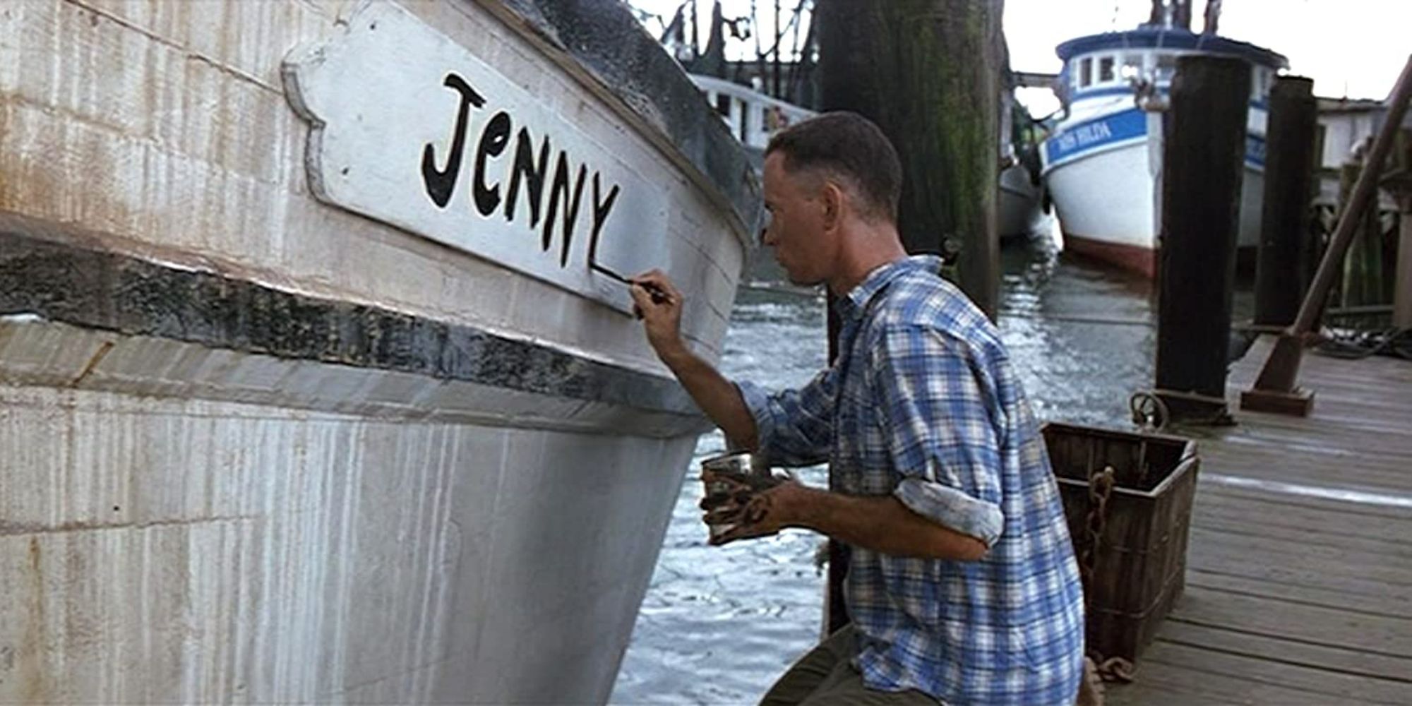 Forrest (Tom Hanks) paints "Jenny" on the side of his shrimping ship in Forrest Gump