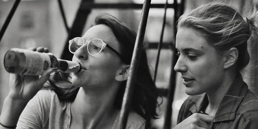 Greta Gerwig with Mickey Sumner sipping a drink in Frances Ha