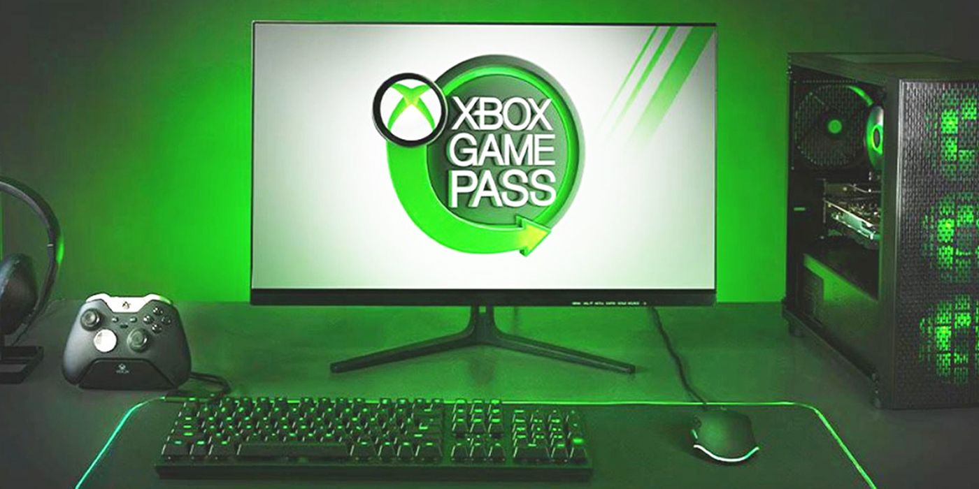 The Xbox Game Pass logo on a PC monitor, surrounded by PC equipment lit up in the Xbox green color scheme