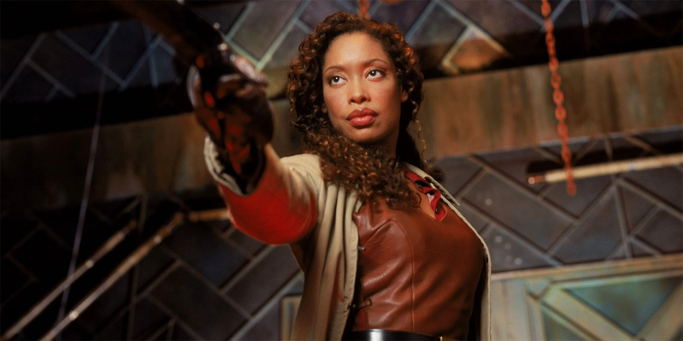 Gina Torres as Zoe pointing her gun in Firefly