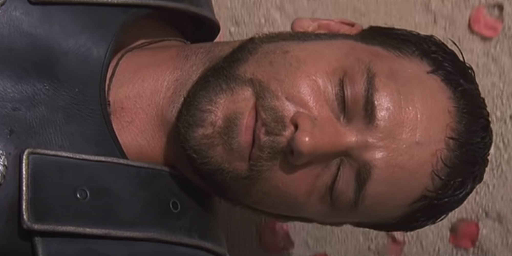 Maximus (Russell Crowe) lying on the ground in Gladiator