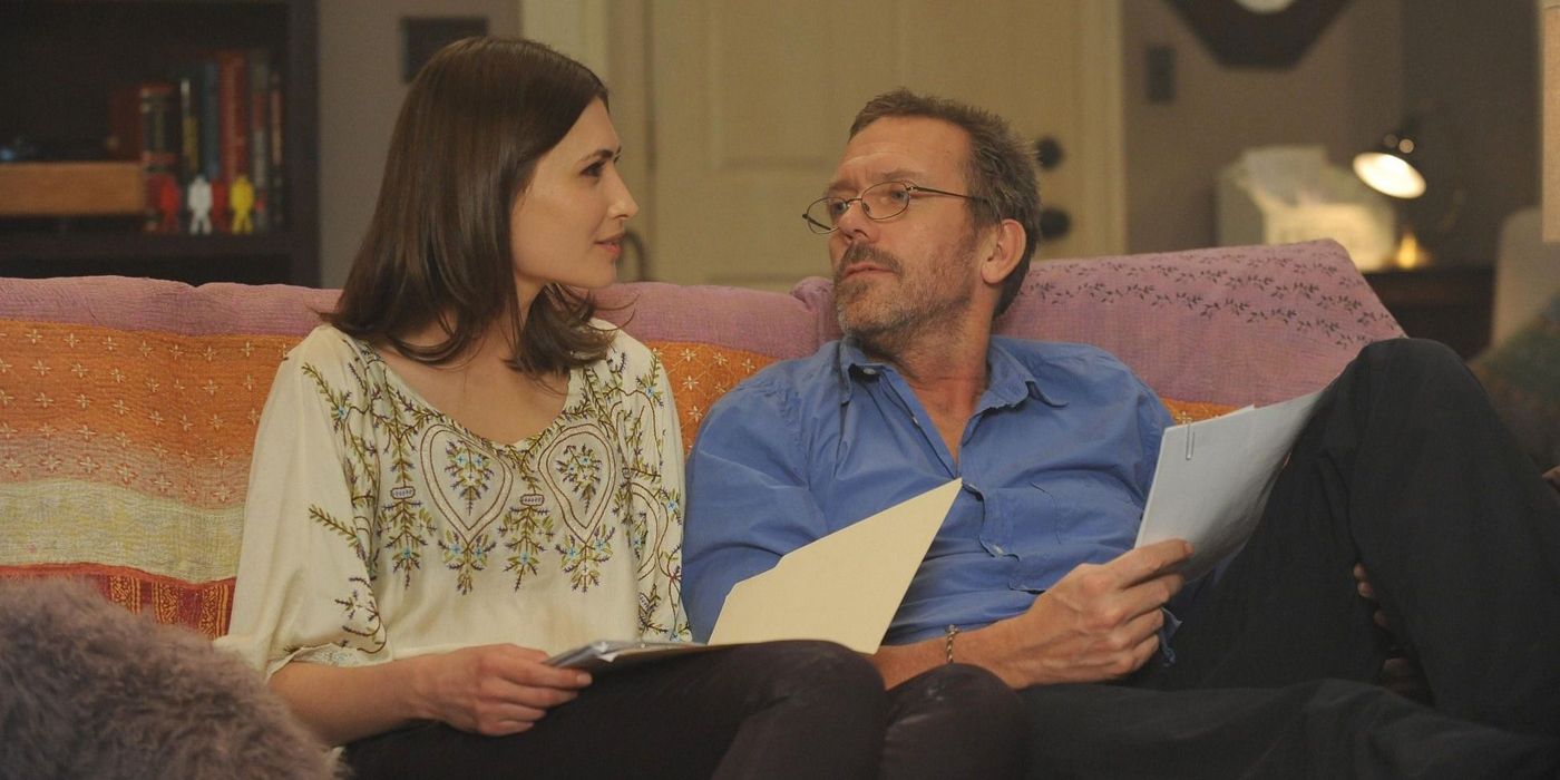 Gregory House and Dominika Petrova Sitting on the Couch with Papers in Their Hands in House, M.D.