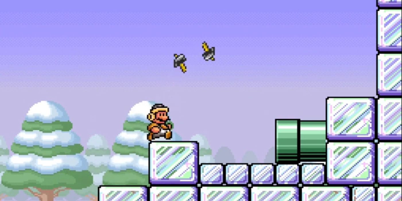 Hammer Suit Mario tossing hammers in the air in an icy zone of the All-Stars version of Super Mario Bros 3.