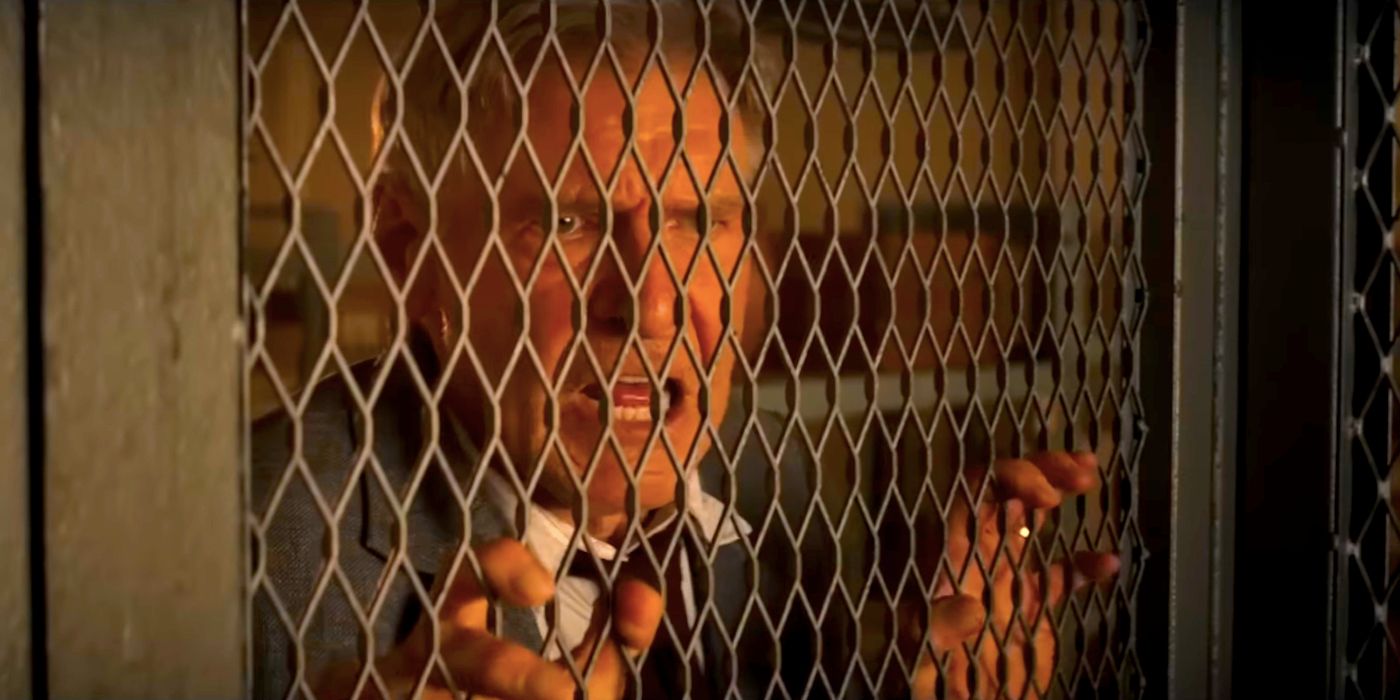 Harrison Ford as Indiana Jones Behind a Grate in Dial of Destiny