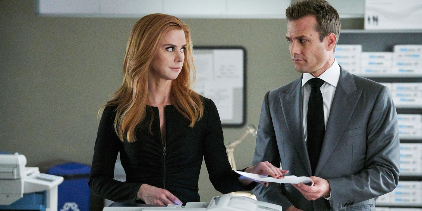 Harvey And Donna with a Complicit Look At The Copier