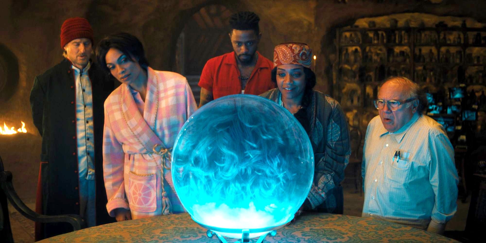 Haunted Mansion characters looking at a crystal ball