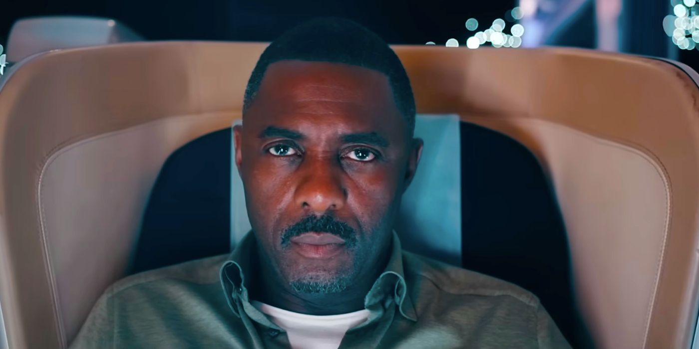 Idris Elba Sitting in an Airplane Seat in Hijack
