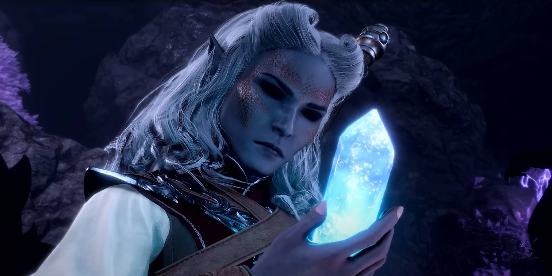 A sorcerer character in Baldur's Gate 3 looks at a shiny blue crystal in their hand.