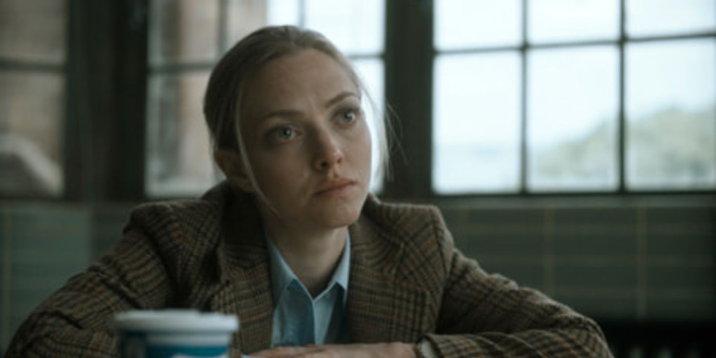The Crowded Room: Rya sitting at a table across from Danny, as she leans in