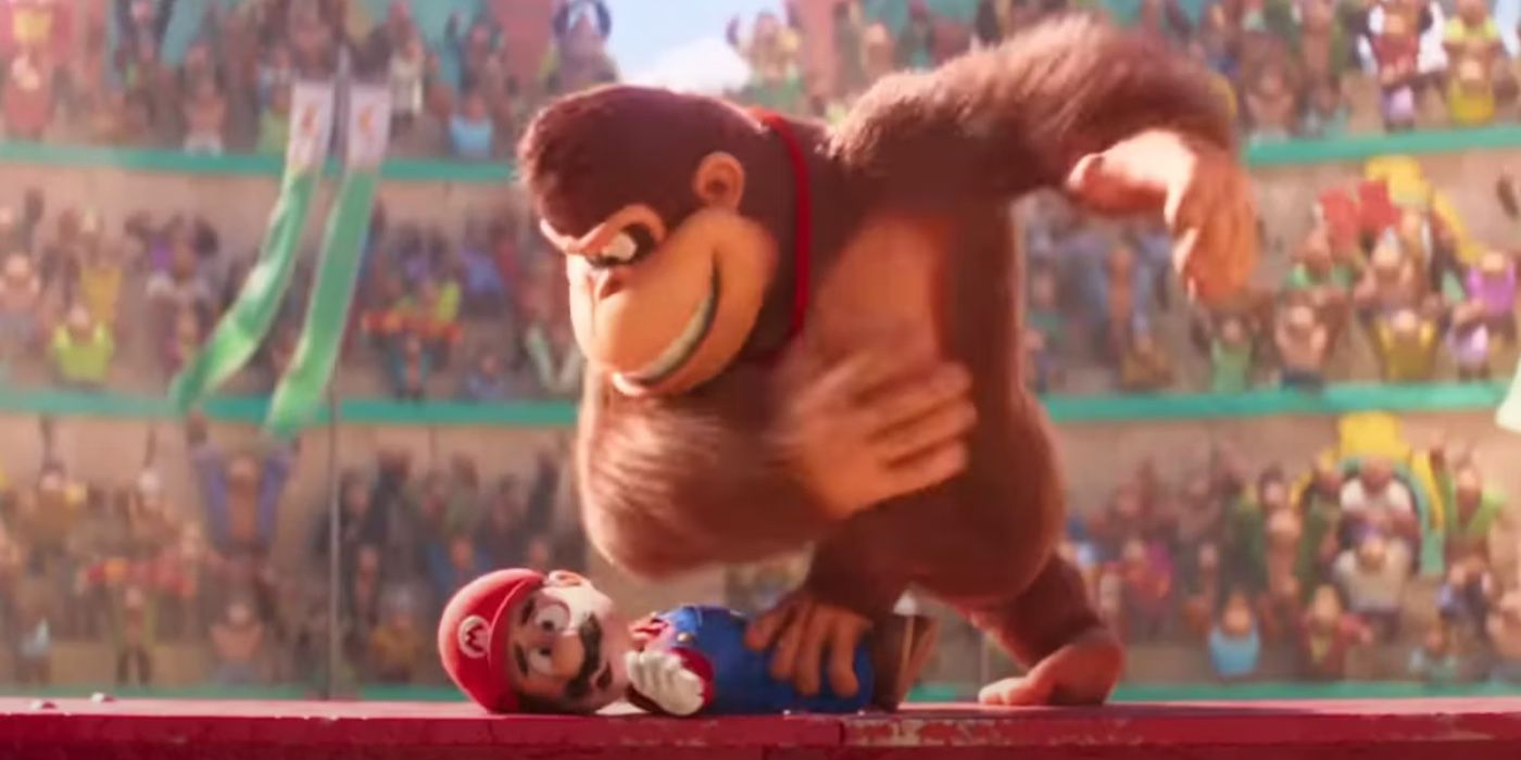 Mario being held down by Donkey Kong in a stadium showdown in The Super Mario Bros. 