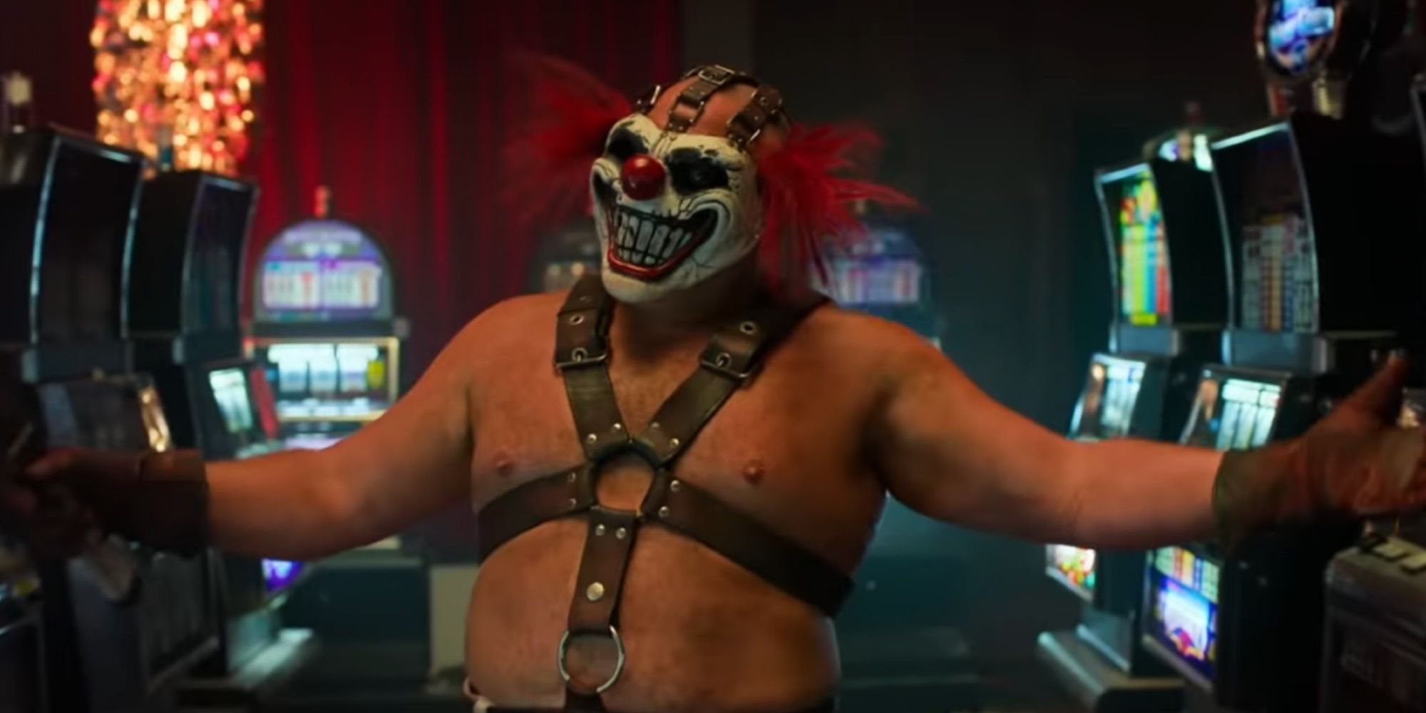 Twisted Metal Season 1: Sweet Tooth with his arms open in his arcade 