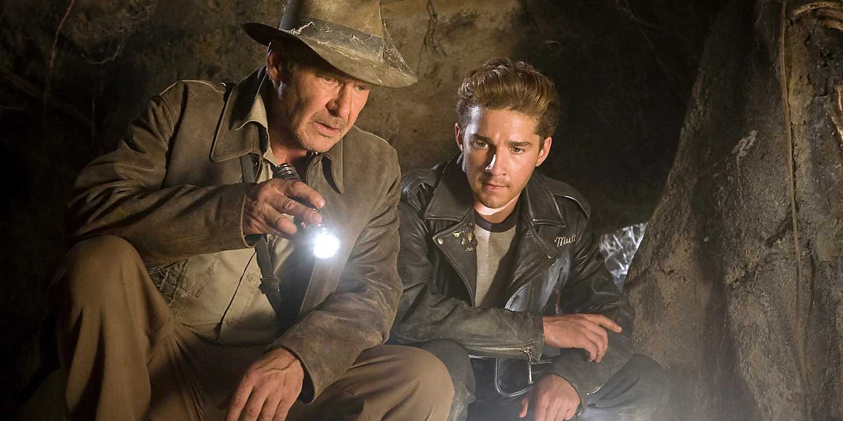 Harrison Ford as Indiana Jones and Shia LaBeouf as Mutt Williams search a cave in Indiana Jones and the Kingdom of the Crystal Skull